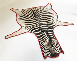 Zebra Hide Rug Trimmed in Maasai Shuka