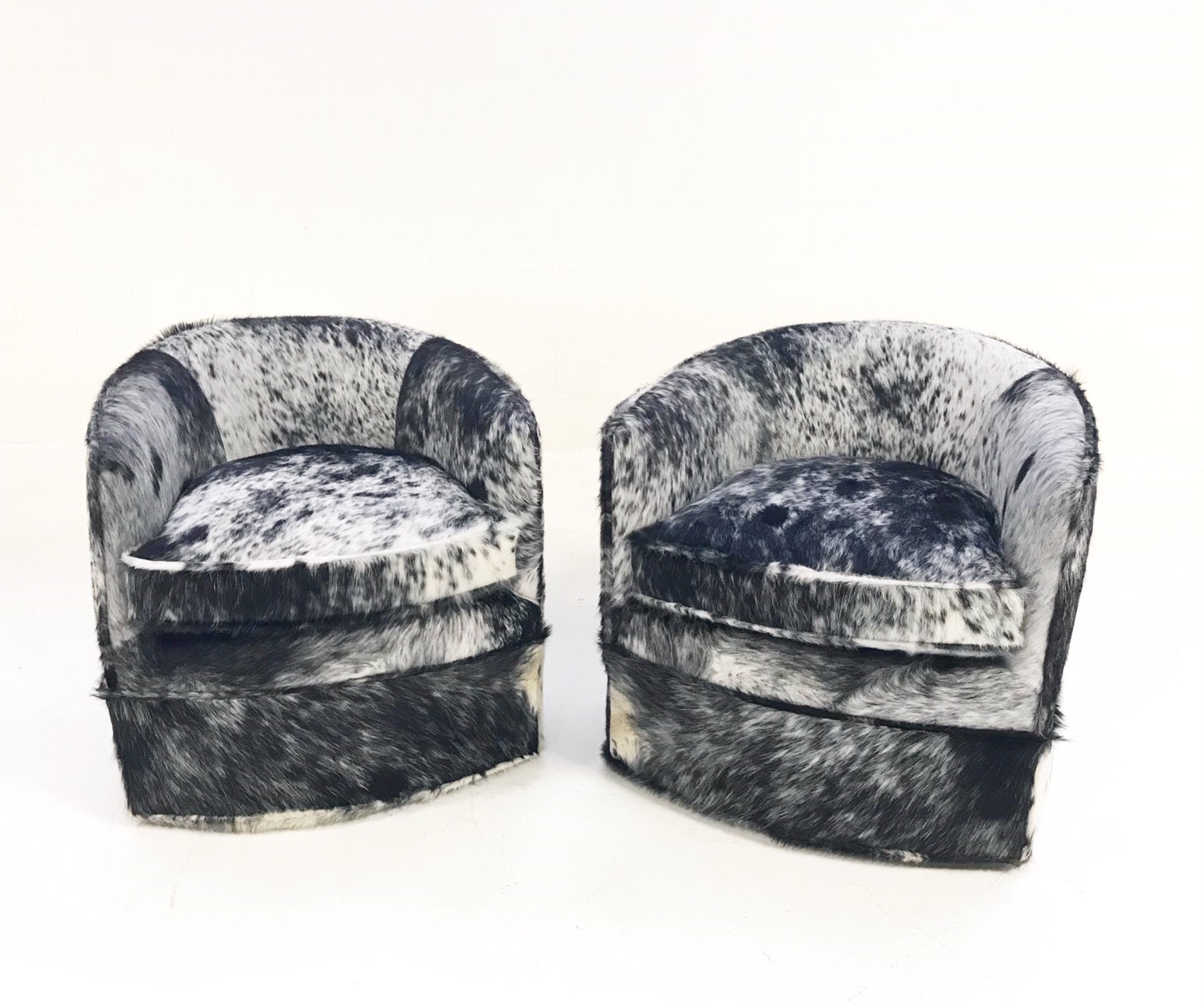 Milo Baughman Wheeled Slipper Chairs Restored and Reupholstered in Black and White Speckled Brazilian Cowhide