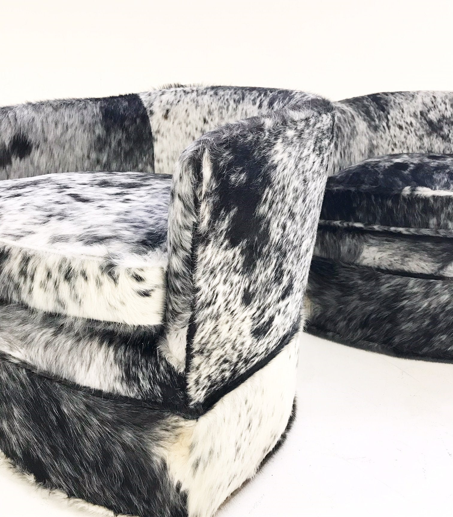 Milo Baughman Wheeled Slipper Chairs Restored and Reupholstered in Black and White Speckled Brazilian Cowhide