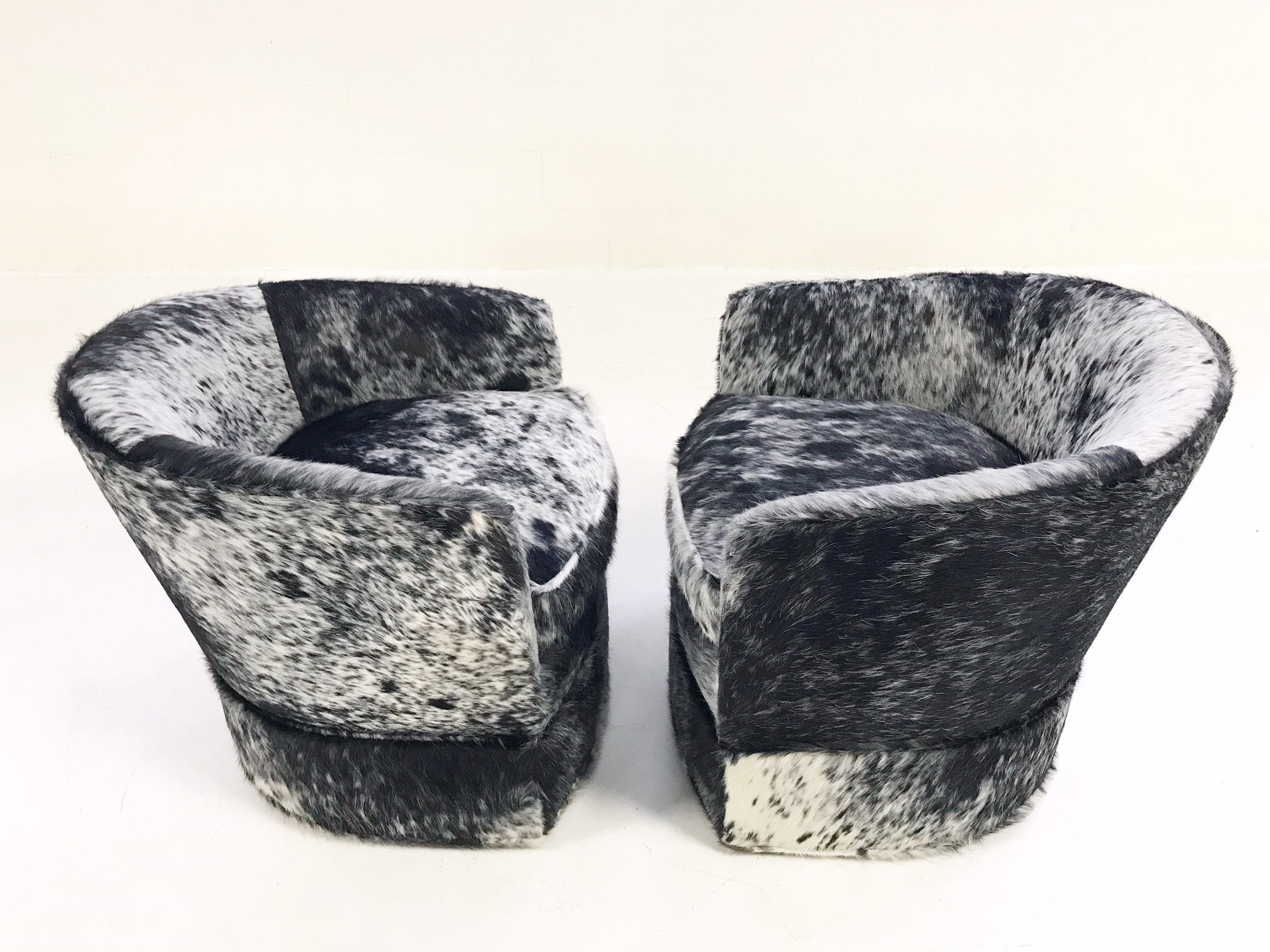 Milo Baughman Wheeled Slipper Chairs Restored and Reupholstered in Black and White Speckled Brazilian Cowhide