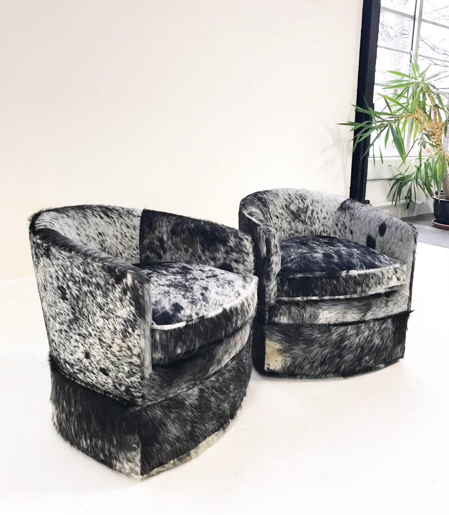 Milo Baughman Wheeled Slipper Chairs Restored and Reupholstered in Black and White Speckled Brazilian Cowhide