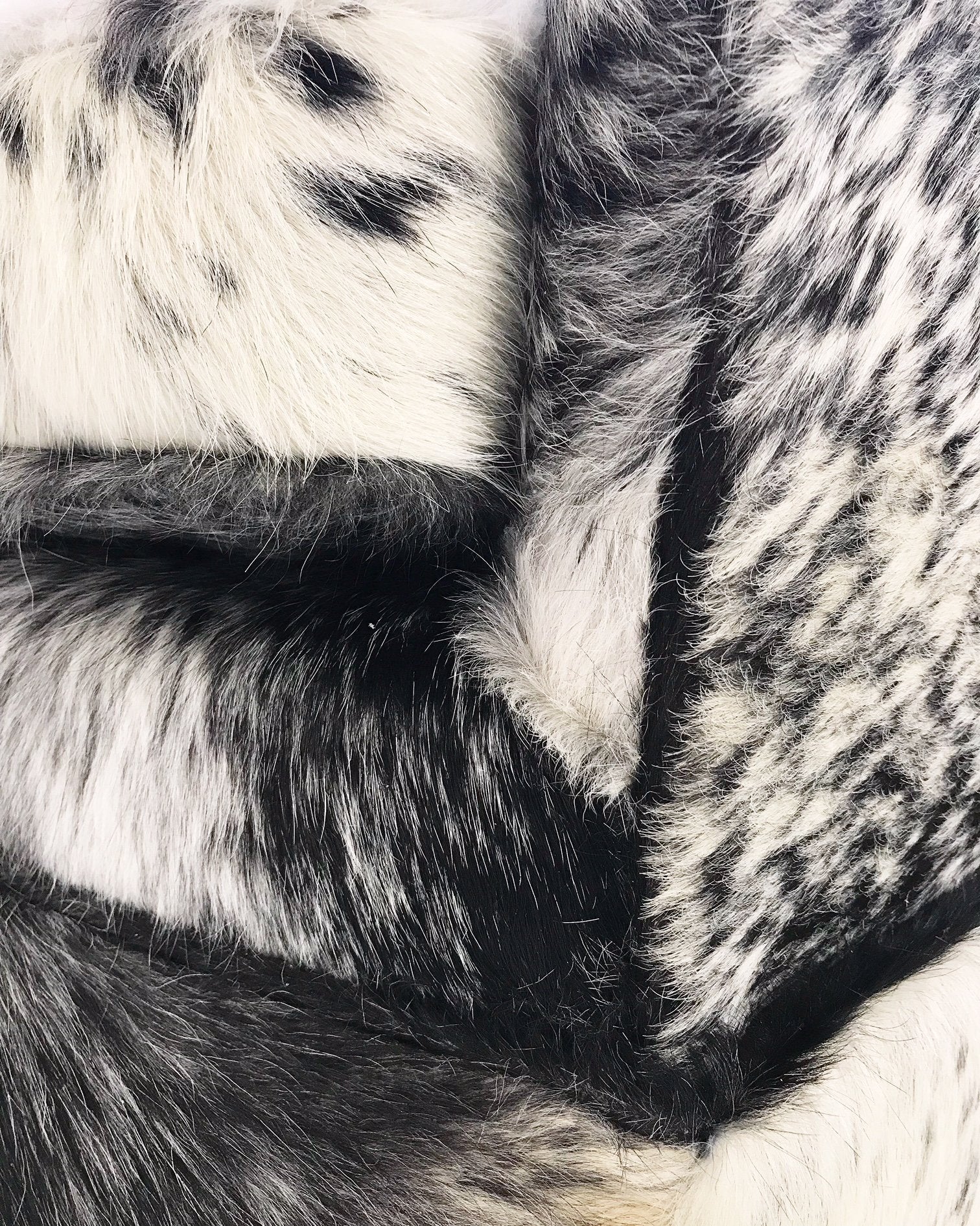 Milo Baughman Wheeled Slipper Chairs Restored and Reupholstered in Black and White Speckled Brazilian Cowhide