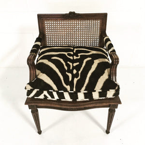 FRENCH LOUIS XVI STYLE BOUDOIR CHAIR WITH CANED BACK AND SEAT AND CUSTOM ZEBRA HIDE CUSHION