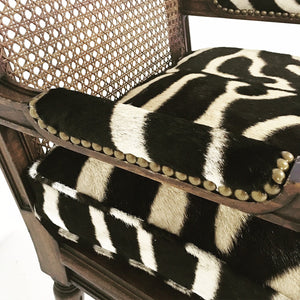 FRENCH LOUIS XVI STYLE BOUDOIR CHAIR WITH CANED BACK AND SEAT AND CUSTOM ZEBRA HIDE CUSHION