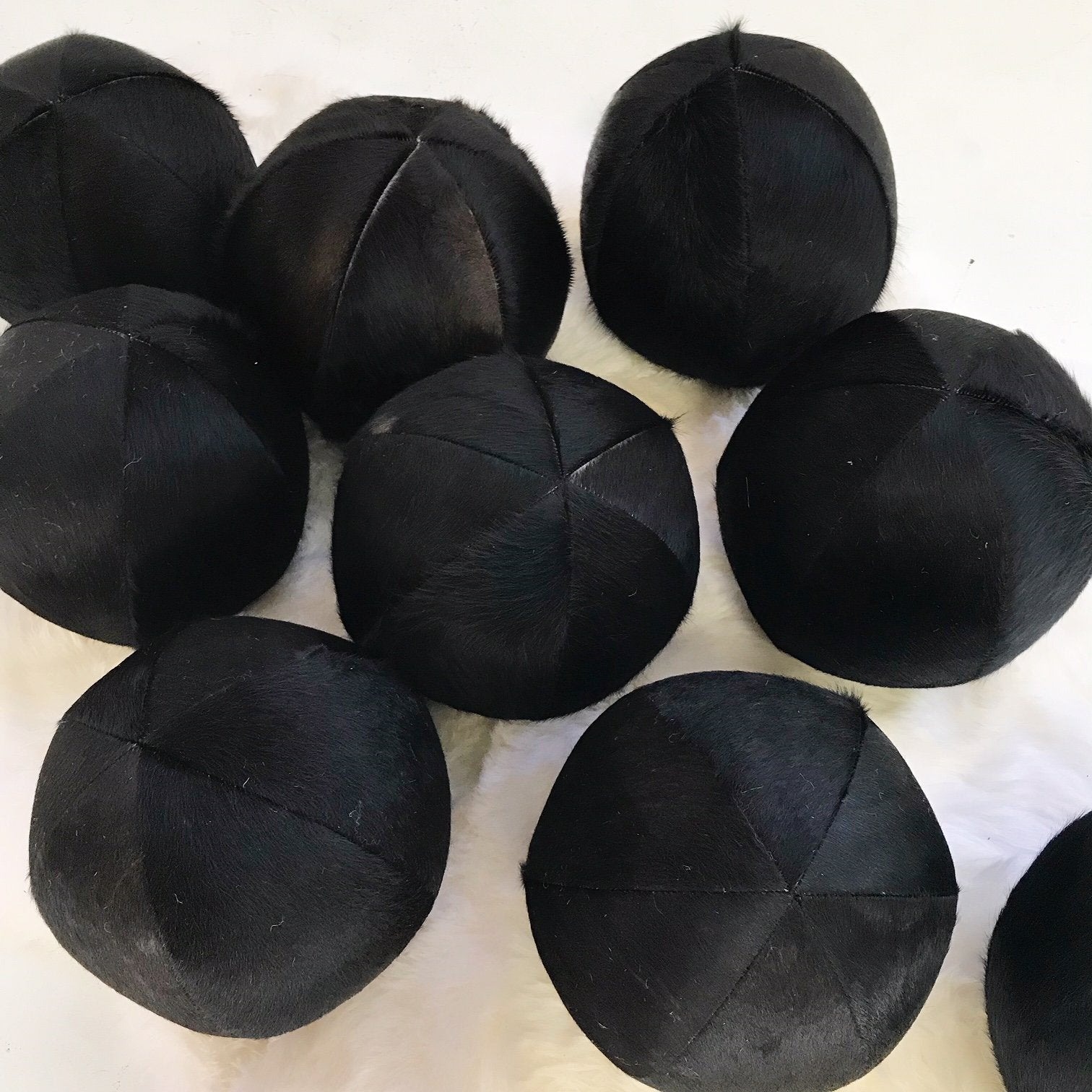 Natural Black Cowhide Ball Pillow 12"