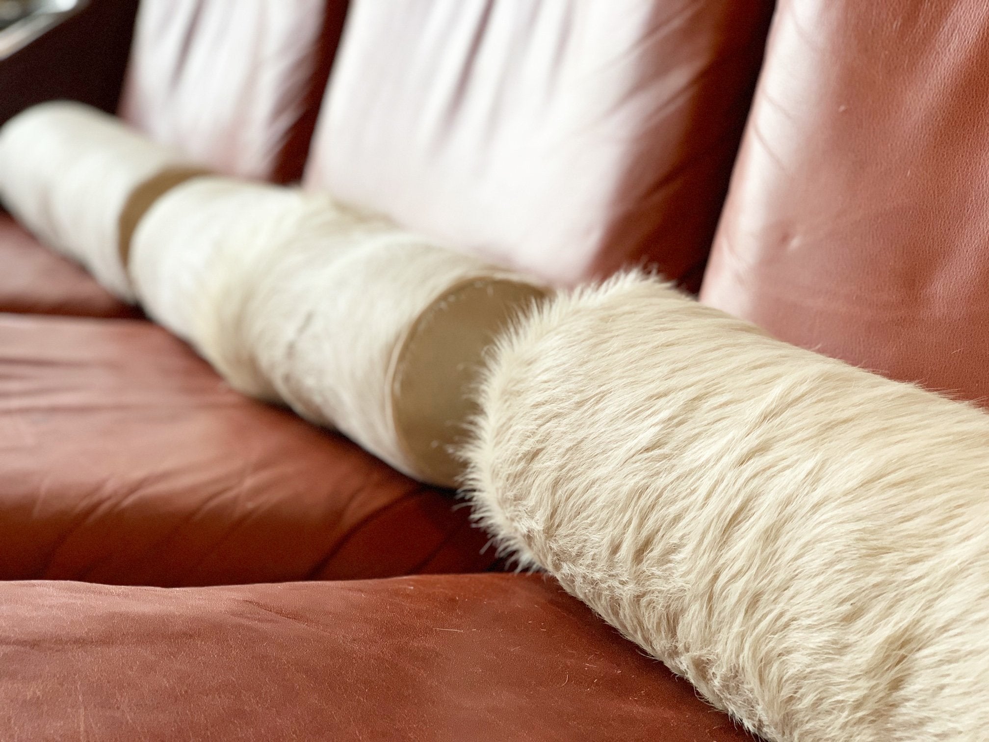 IVORY BRAZILIAN COWHIDE BOLSTER PILLOW 20"