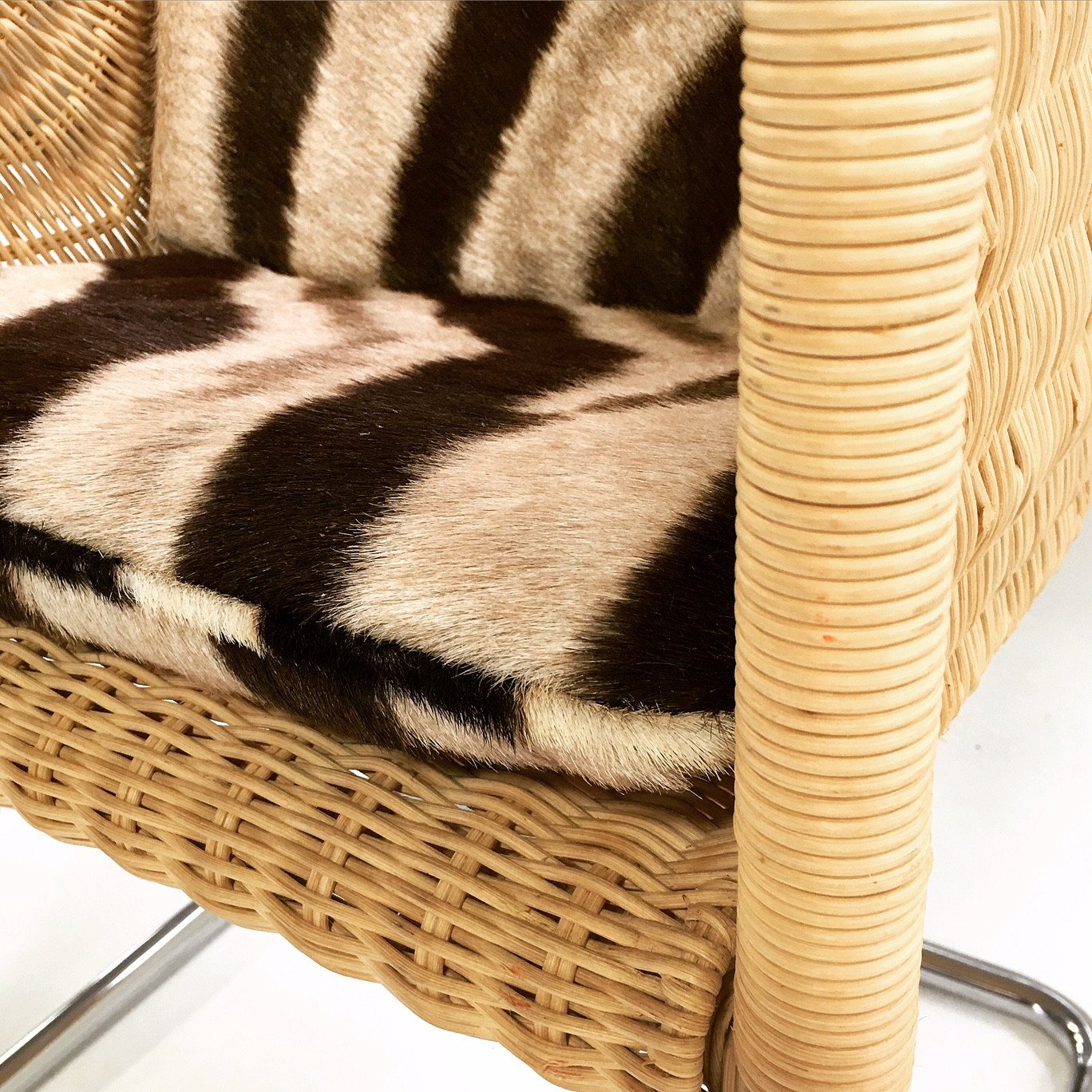 HARVEY PROBBER WICKER AND CHROME CHAIR WITH ZEBRA CUSHIONs