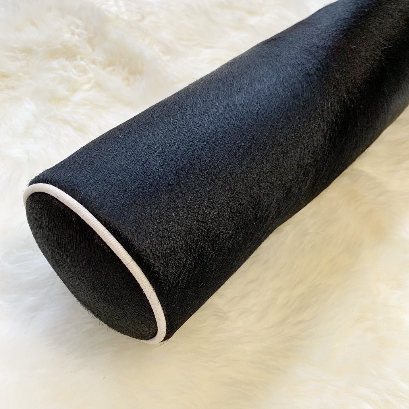 BLACK BRAZILIAN COWHIDE BOLSTER PILLOW 20"