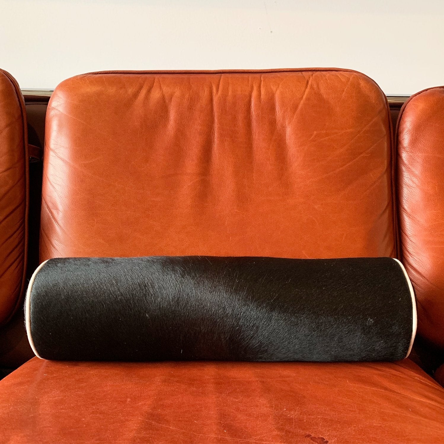 BLACK BRAZILIAN COWHIDE BOLSTER PILLOW 20"