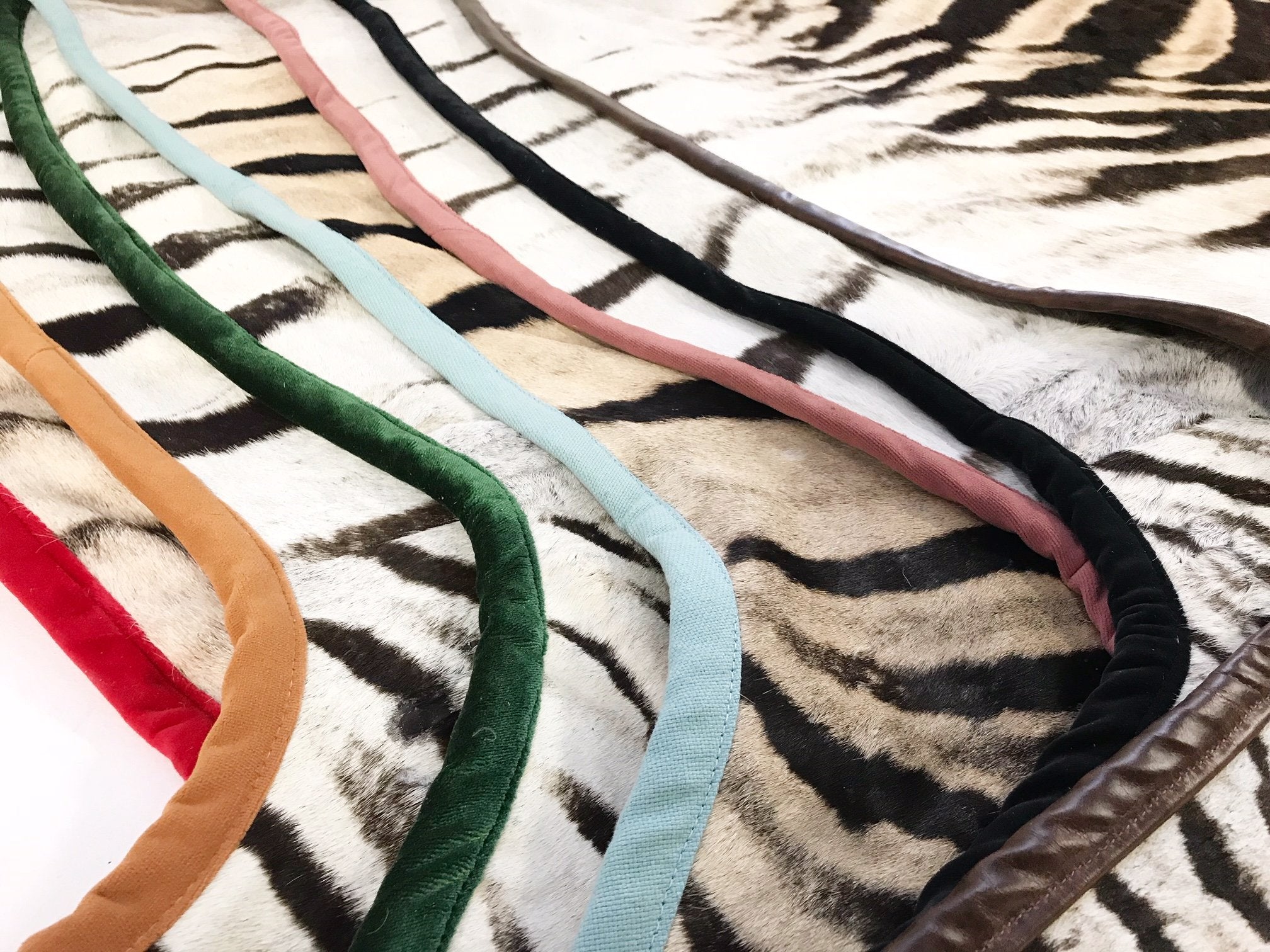 Zebra Hide Rug Trimmed in Schumacher's Emerald Green Silk Velvet