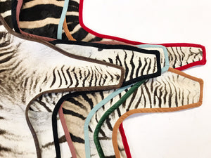 Zebra Hide Rug Trimmed in Red Velvet