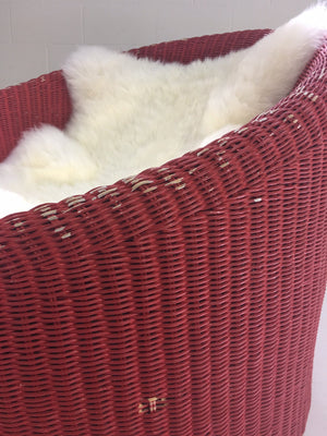 PAIR of EERO AARNIO FOR STENDIG WOVEN RATTAN LOUNGE CHAIRS WITH SHEEPSKIN THROWS