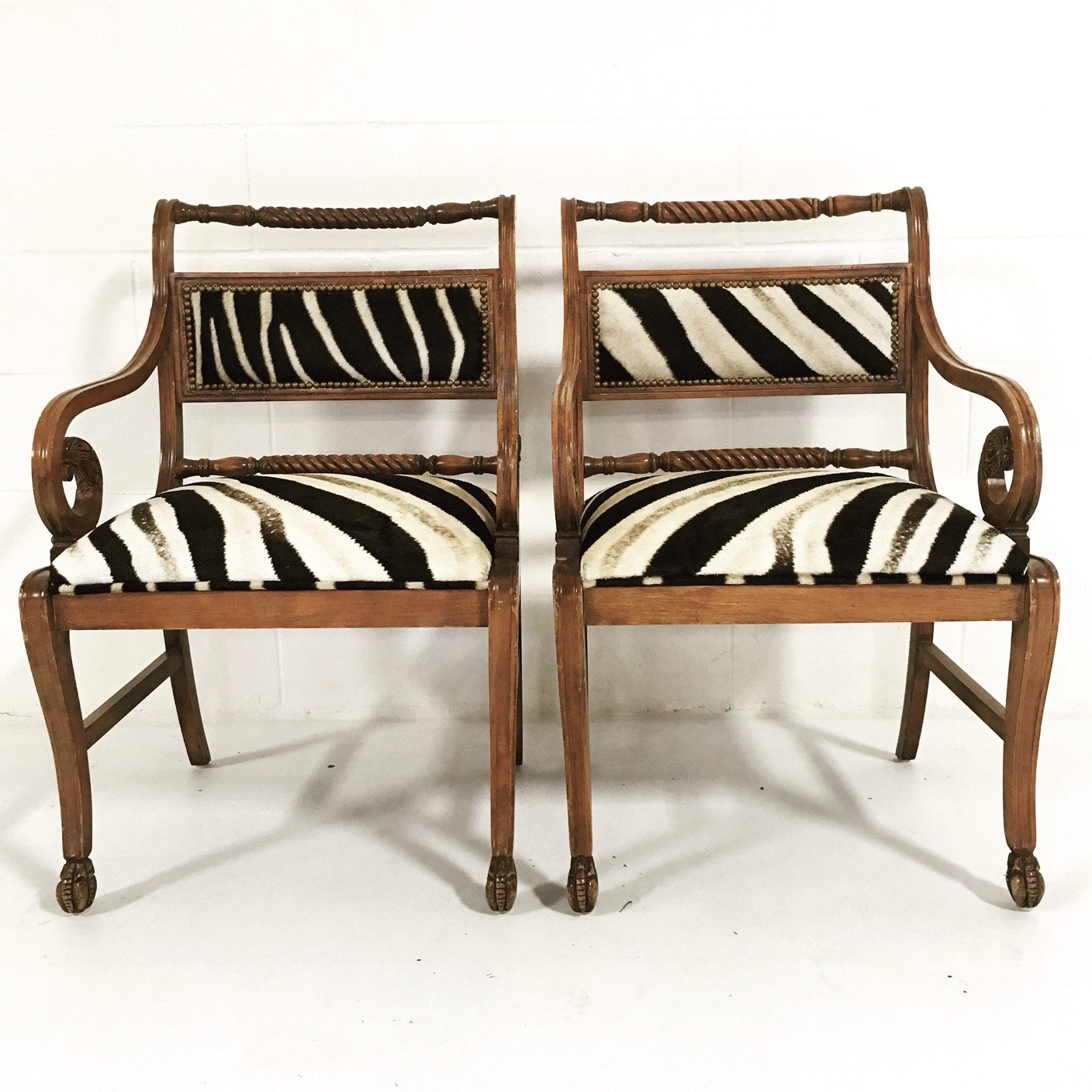PAIR OF VINTAGE CARVED ARMCHAIRS IN ZEBRA HIDE