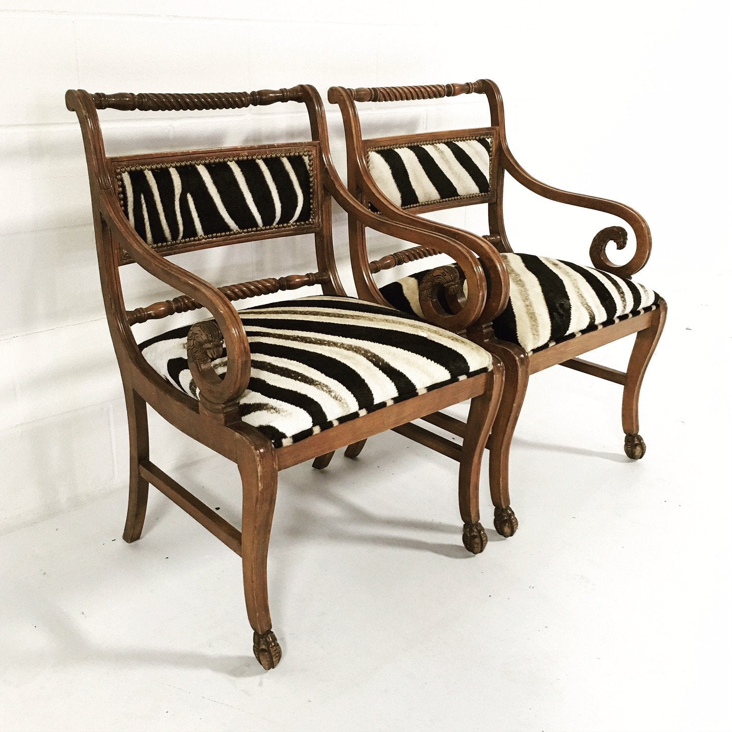 PAIR OF VINTAGE CARVED ARMCHAIRS IN ZEBRA HIDE