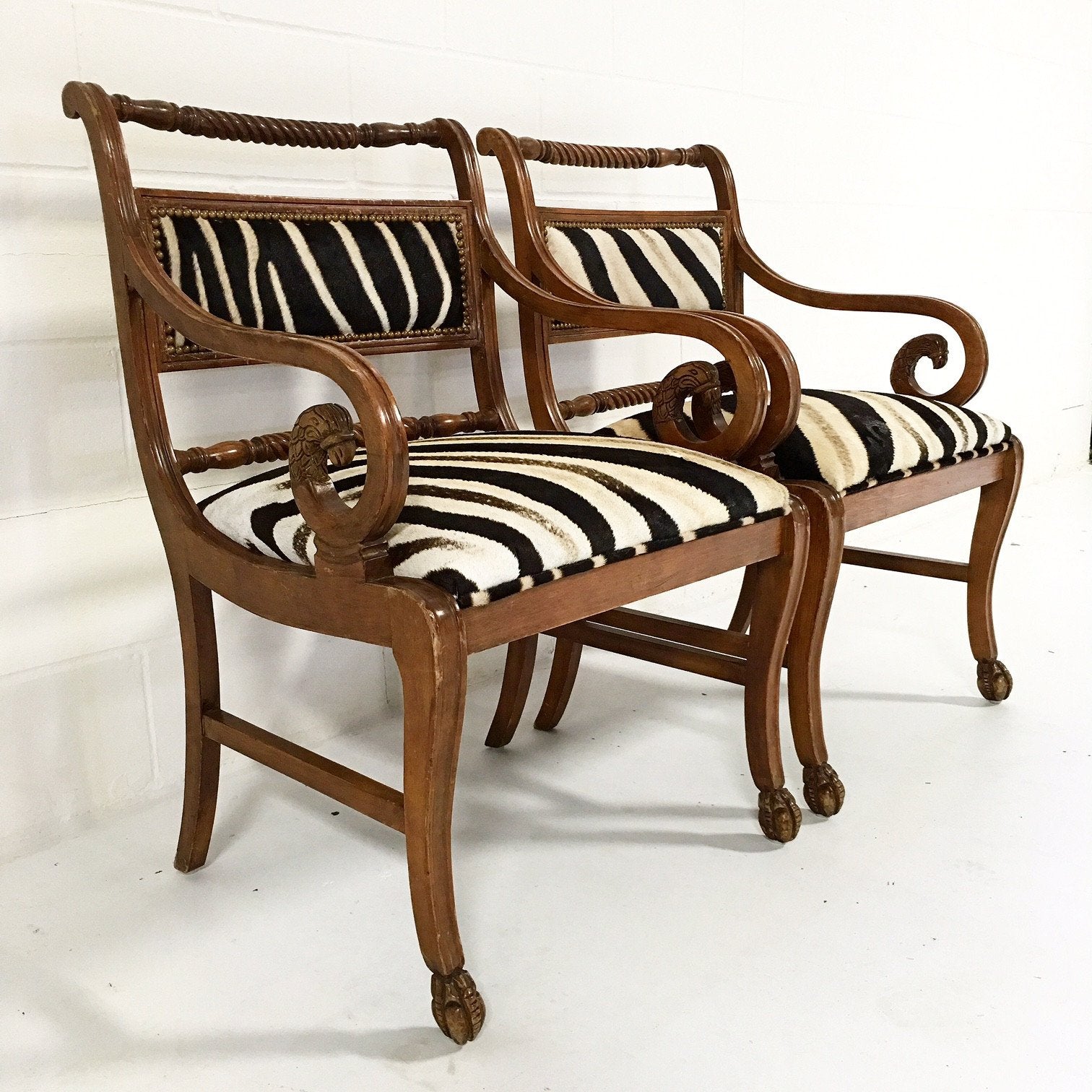 PAIR OF VINTAGE CARVED ARMCHAIRS IN ZEBRA HIDE