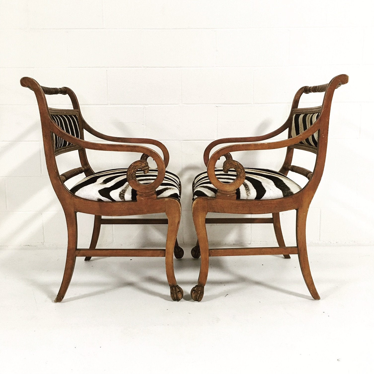 PAIR OF VINTAGE CARVED ARMCHAIRS IN ZEBRA HIDE