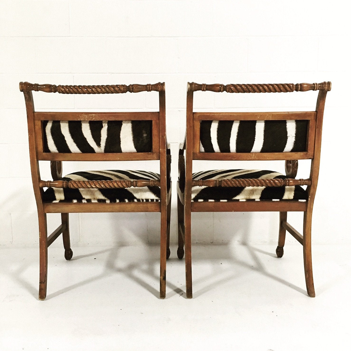 PAIR OF VINTAGE CARVED ARMCHAIRS IN ZEBRA HIDE