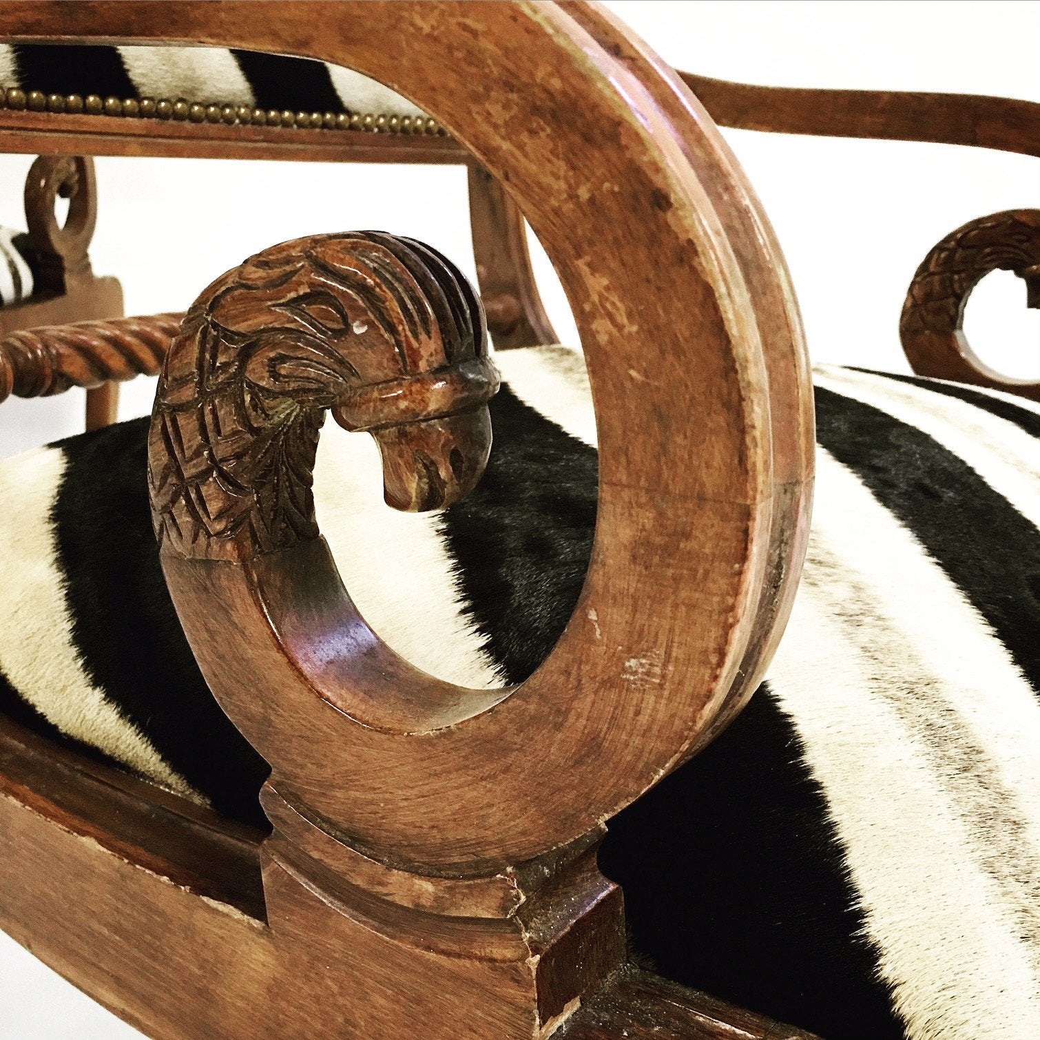 PAIR OF VINTAGE CARVED ARMCHAIRS IN ZEBRA HIDE
