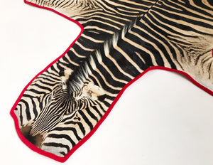 Zebra Hide Rug Trimmed in Red Velvet