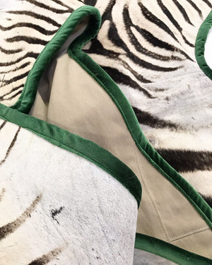 Zebra Hide Rug Trimmed in Schumacher's Emerald Green Silk Velvet