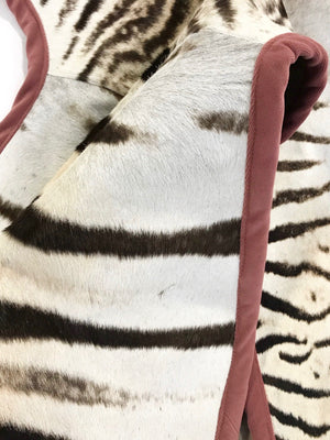 Zebra Hide Rug Trimmed in Blush Pink Velvet