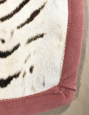 Zebra Hide Rug Trimmed in Blush Pink Velvet