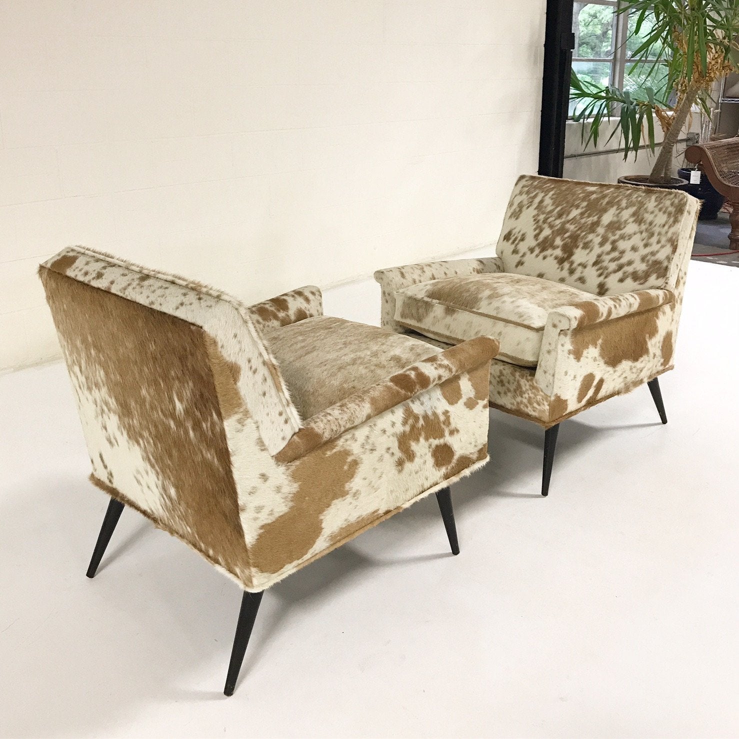Paul McCobb Lounge Chairs in Palomino and White Cowhide