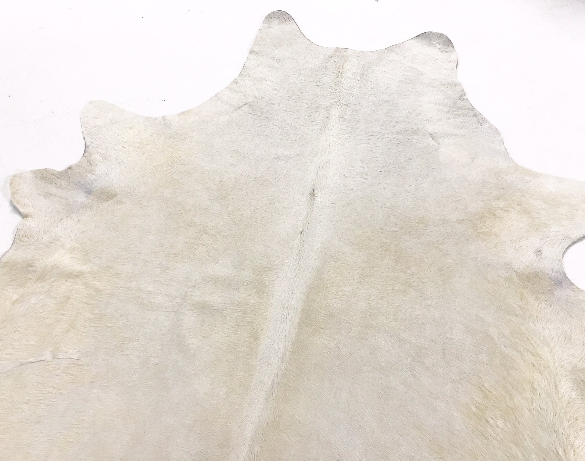 IVORY COWHIDE RUG - BUTLER