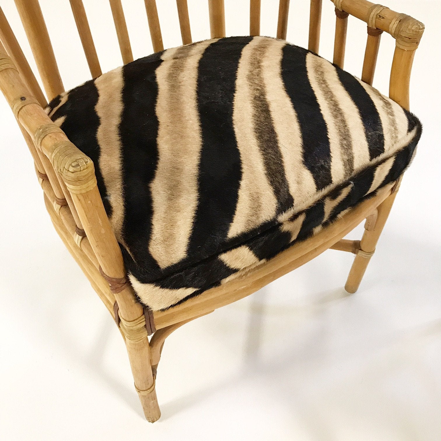 Pair of Rattan Armchairs with Zebra Hide Cushions
