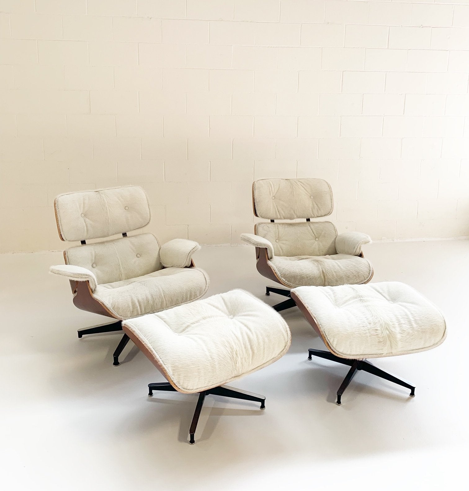 Charles and Ray Eames for Herman Miller 670 Lounge Chairs and 671 Ottomans in Brazilian Cowhide