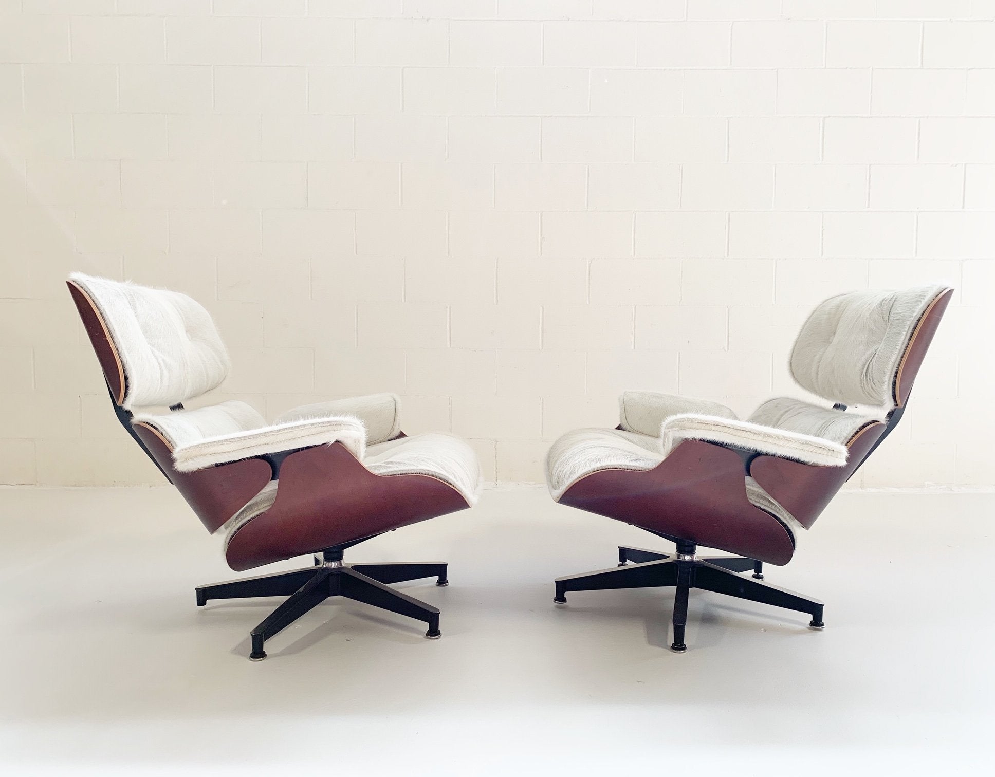 Charles and Ray Eames for Herman Miller 670 Lounge Chairs and 671 Ottomans in Brazilian Cowhide