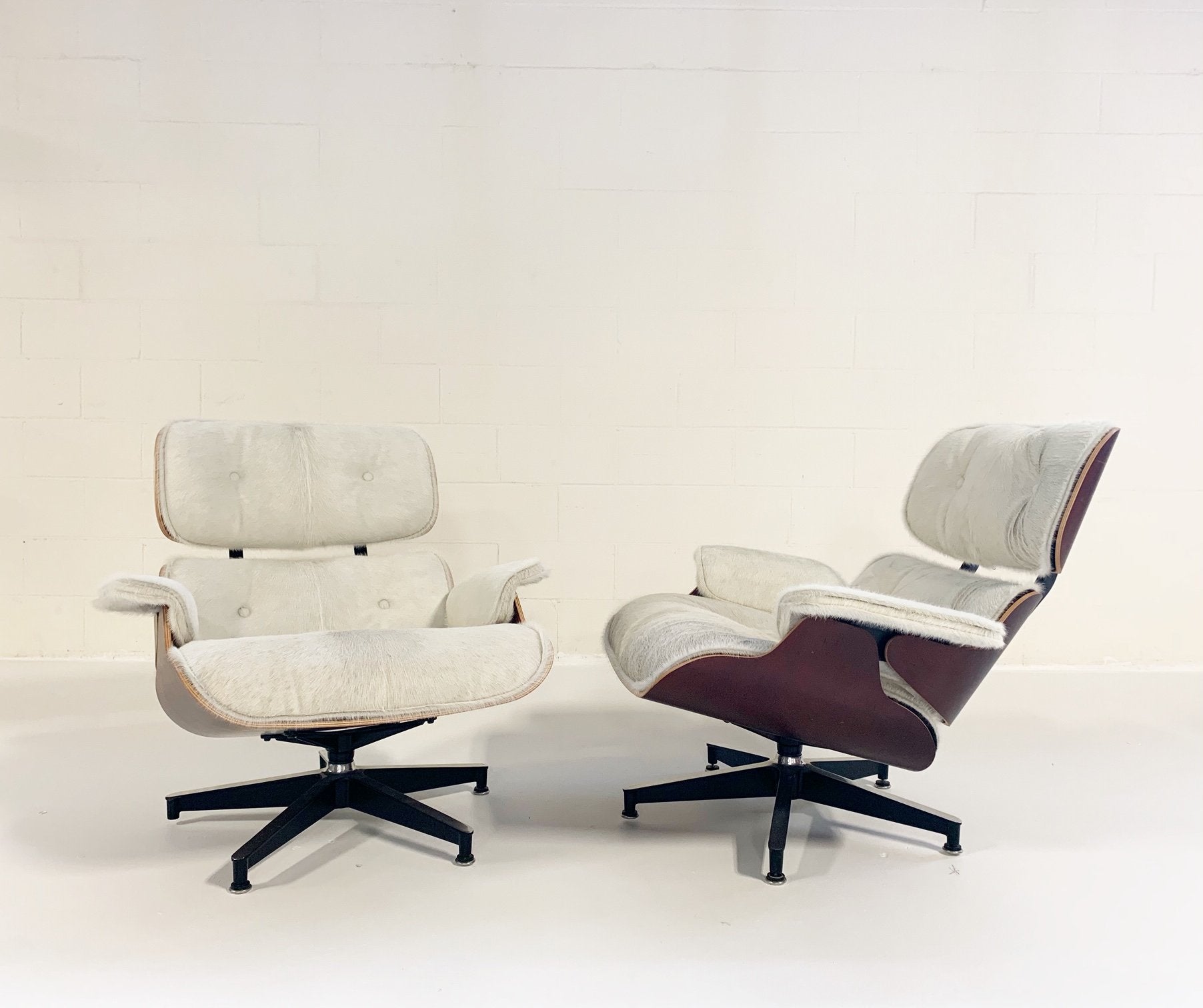 Charles and Ray Eames for Herman Miller 670 Lounge Chairs and 671 Ottomans in Brazilian Cowhide