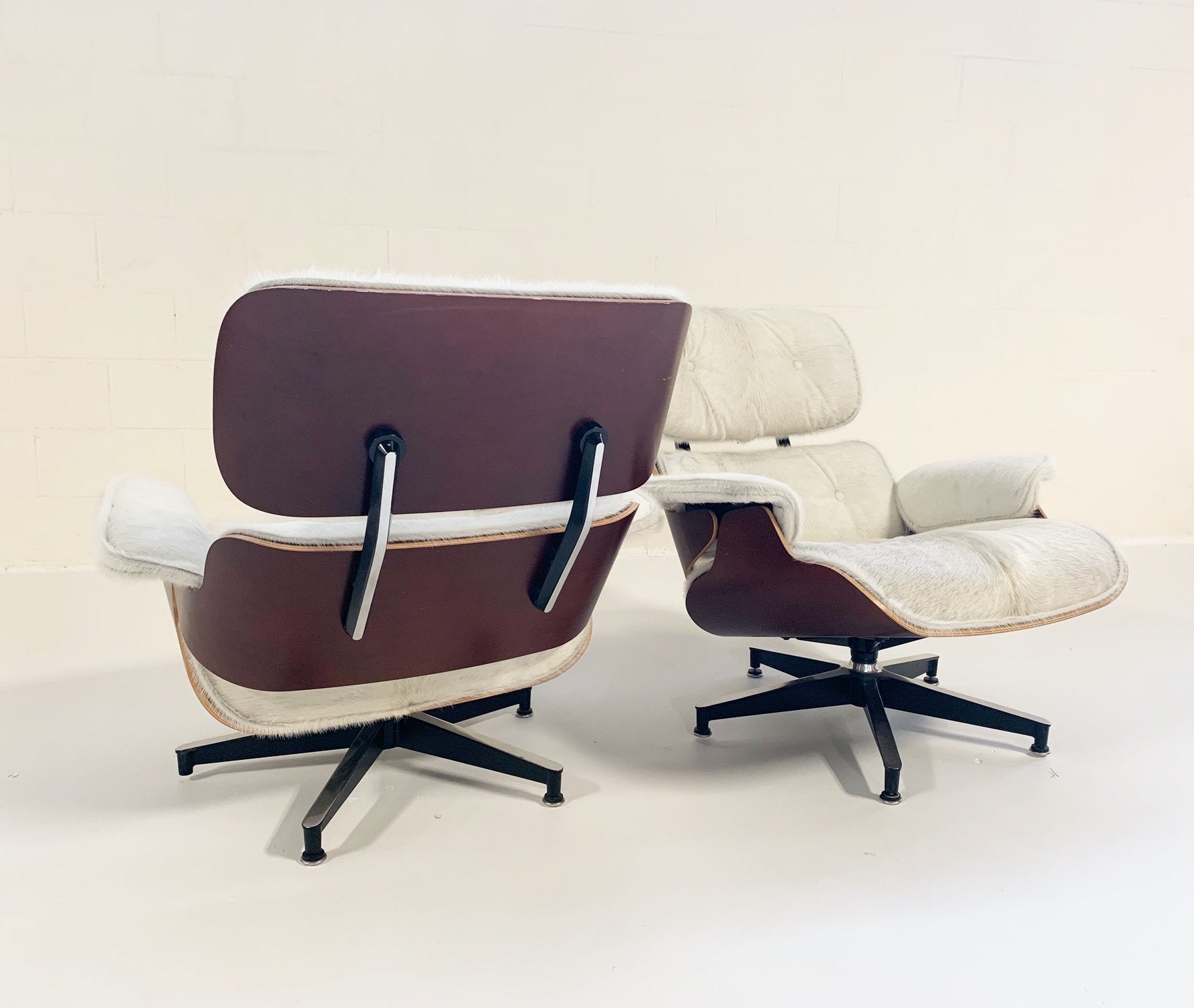 Charles and Ray Eames for Herman Miller 670 Lounge Chairs and 671 Ottomans in Brazilian Cowhide