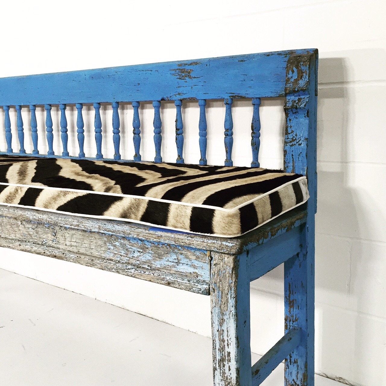 VINTAGE BLUE FARMHOUSE BENCH WITH ZEBRA HIDE CUSHION
