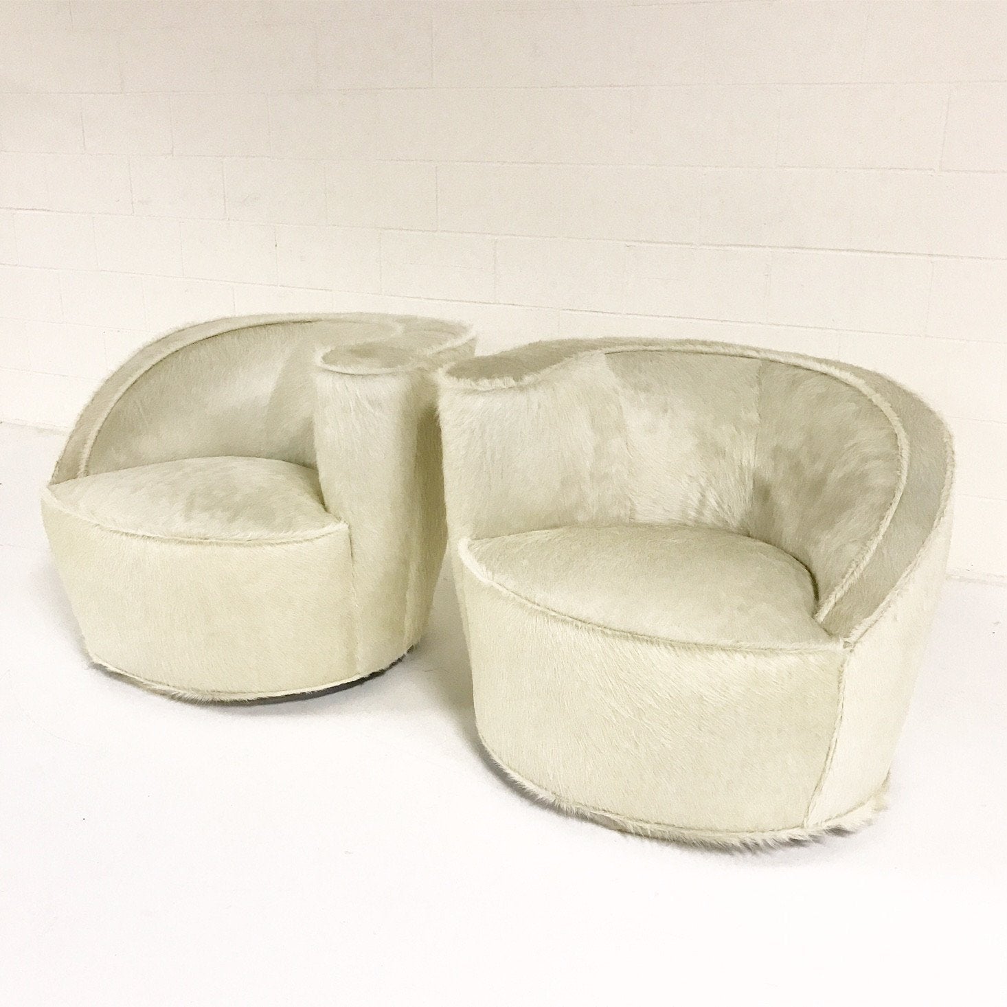 Pair of Vladimir Kagan Nautilus Chairs in Ivory Brazilian Cowhide