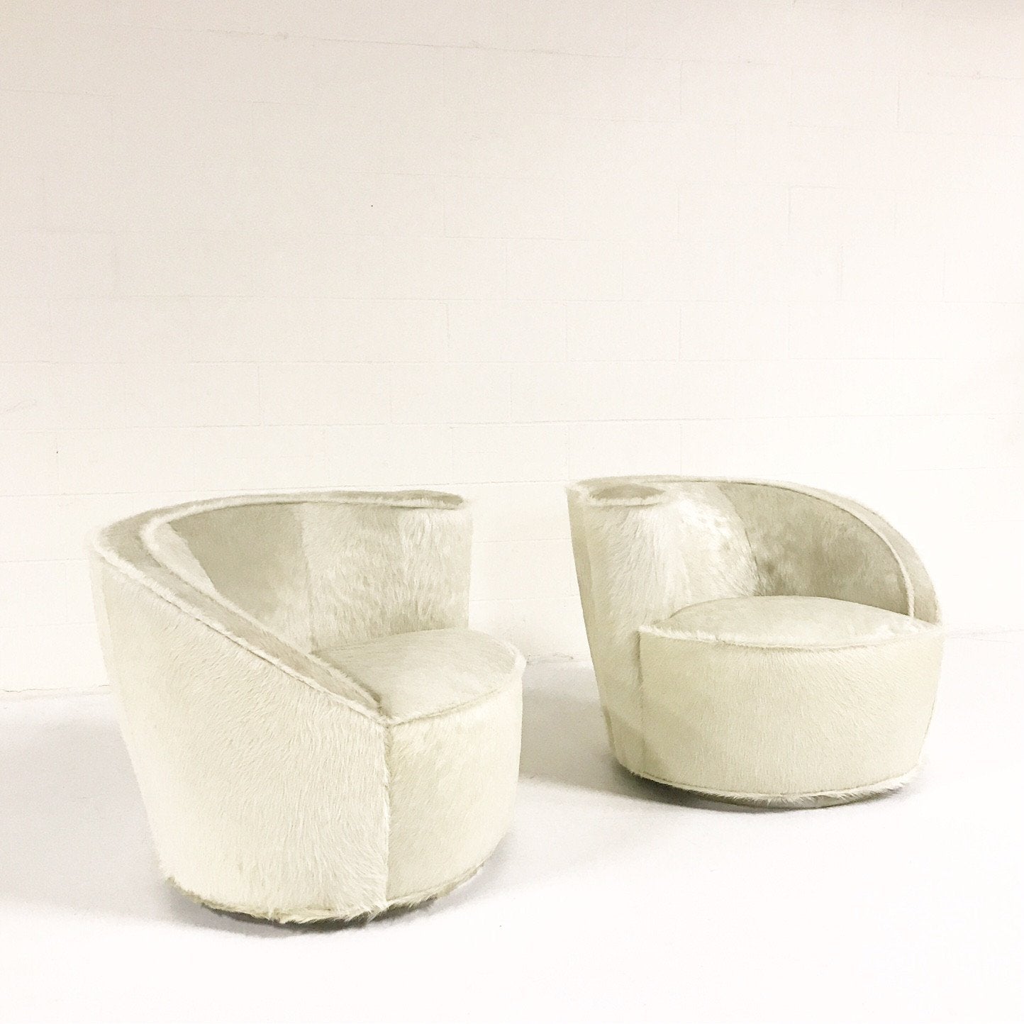 Pair of Vladimir Kagan Nautilus Chairs in Ivory Brazilian Cowhide