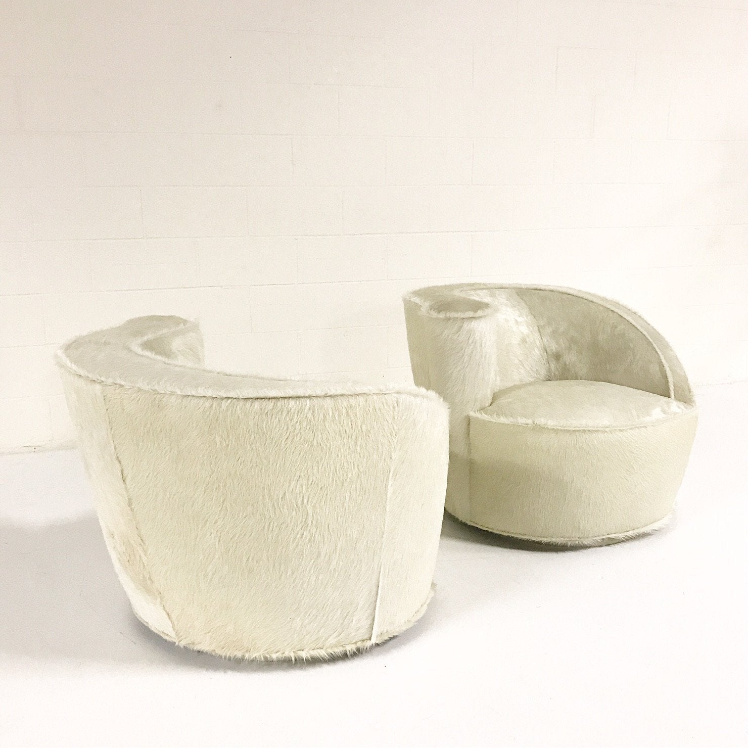 Pair of Vladimir Kagan Nautilus Chairs in Ivory Brazilian Cowhide