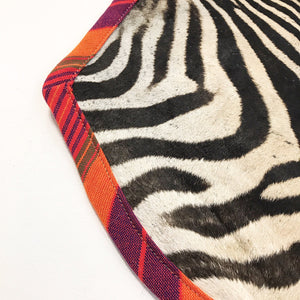 Zebra Hide Rug Trimmed in Maasai Shuka
