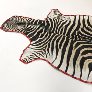 Zebra Hide Rug Trimmed in Maasai Shuka