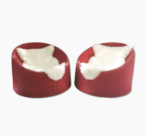 PAIR of EERO AARNIO FOR STENDIG WOVEN RATTAN LOUNGE CHAIRS WITH SHEEPSKIN THROWS
