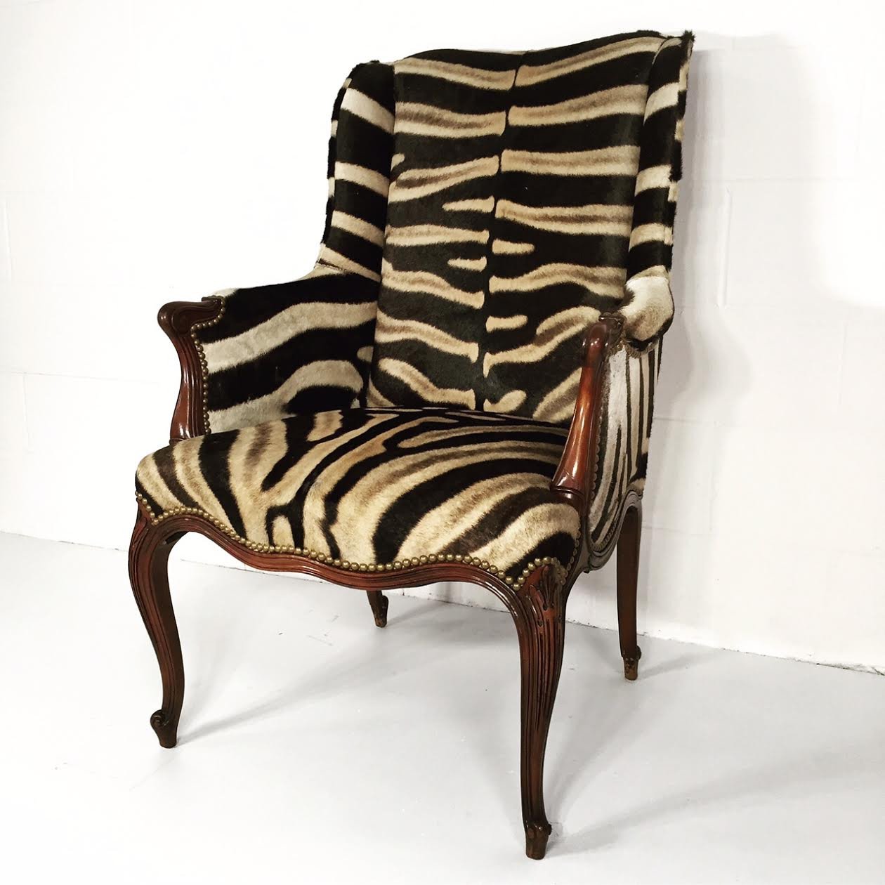 ENGLISH MAHOGANY WINGBACK ARMCHAIR IN Zebra